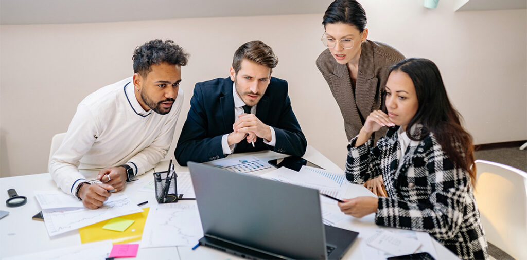 Guys looking at a laptop thinking, Revenue-based Financing